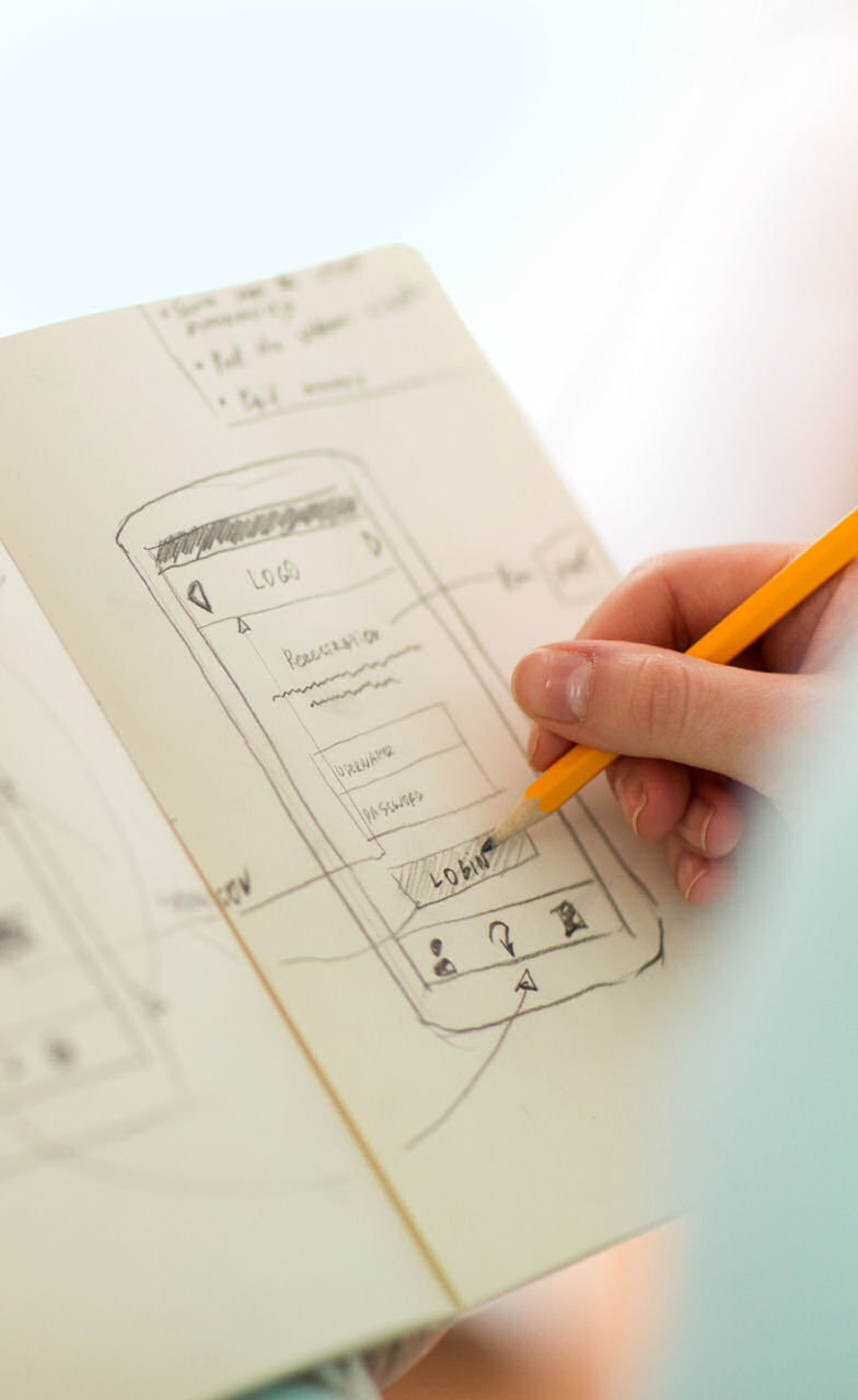 Our graphic designer creating a mockup of a mobile app for a local client